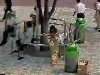 Changing in the street - Japanese teenager in public first part